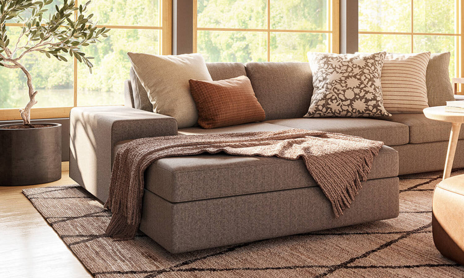 IRL: Blumen Chaise Left Sectional in Melton Feather fabric, Voya Coffee and Side Tables, Mayer Poufs in Sundance leather, and Lulu & Judge Throw Pillows