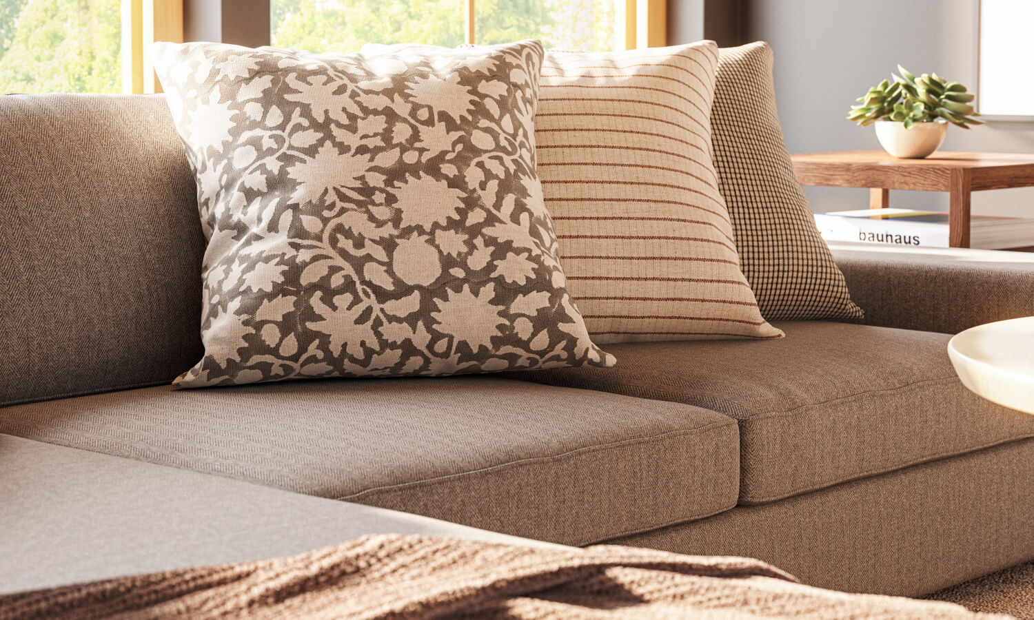 IRL: Blumen Chaise Left Sectional in Melton Feather fabric, Voya Coffee and Side Tables, Mayer Poufs in Sundance leather, and Lulu & Judge Throw Pillows