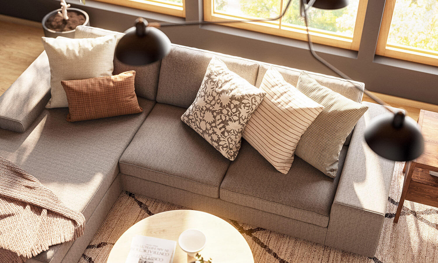 IRL: Blumen Chaise Left Sectional in Melton Feather fabric, Voya Coffee and Side Tables, Mayer Poufs in Sundance leather, and Lulu & Judge Throw Pillows