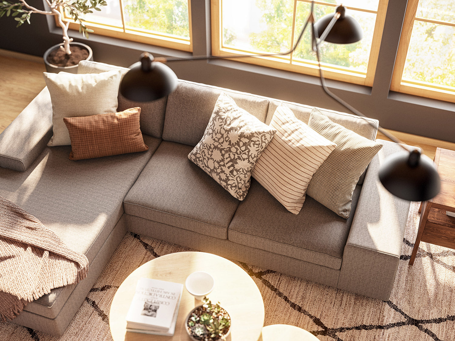 Blumen Chaise Left Sectional in Melton Feather fabric, Voya Coffee and Side Tables, Mayer Poufs in Sundance leather, and Lulu & Judge Throw Pillows