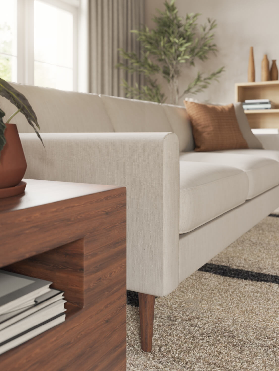 IRL: Lala sofa in beige fabric with orange pillow