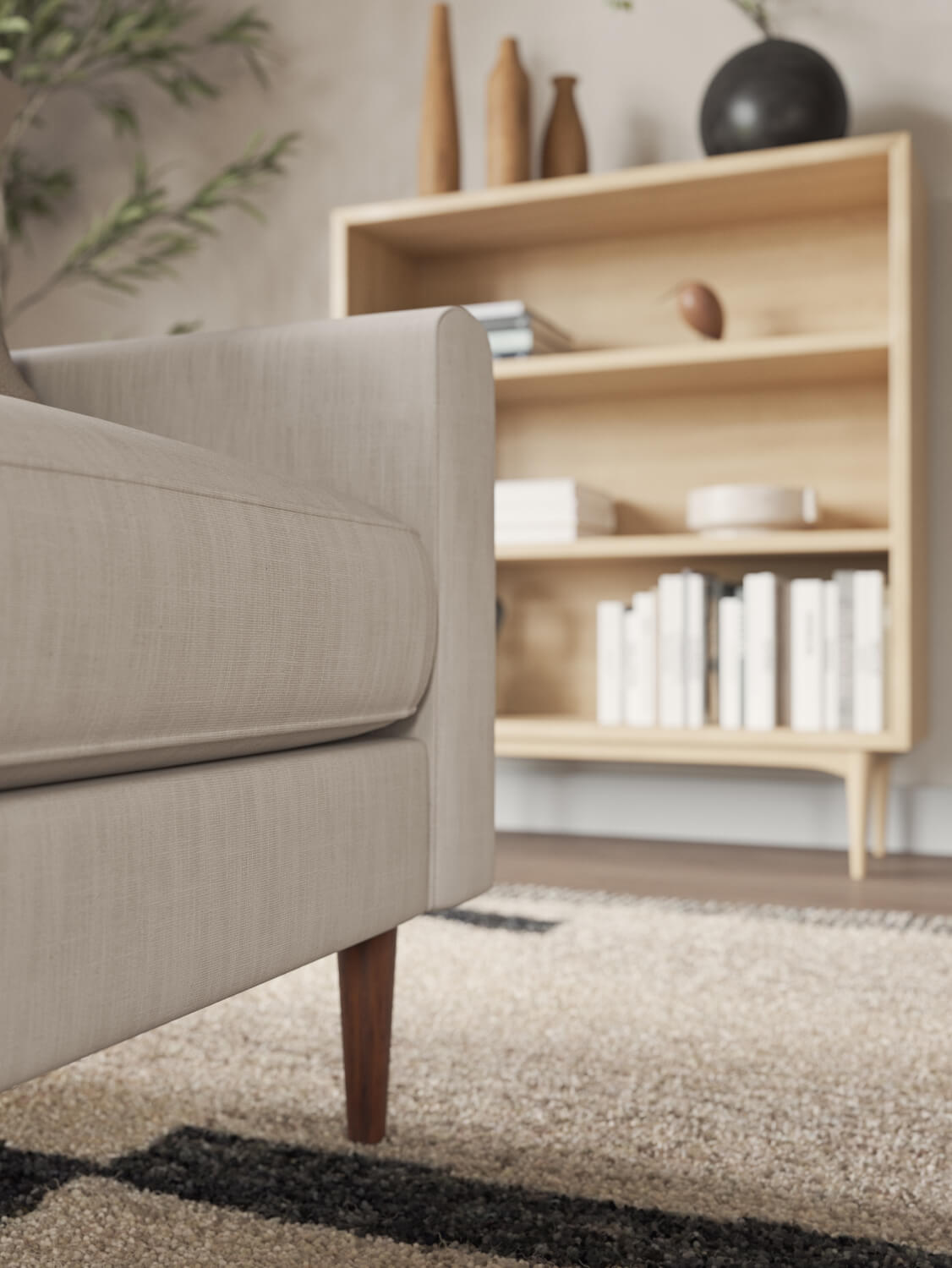 IRL: Lala sofa in beige fabric with orange pillow
