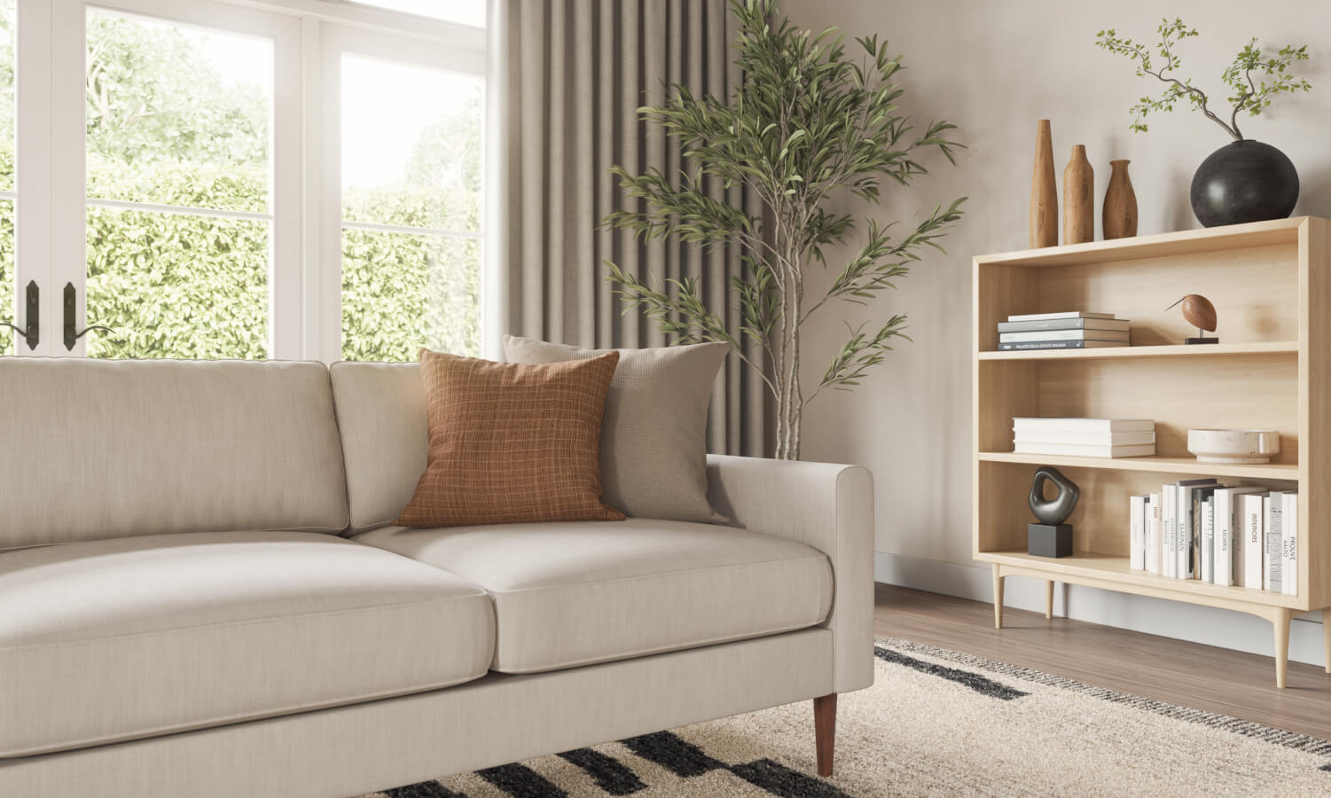IRL: Lala sofa in beige fabric with orange pillow