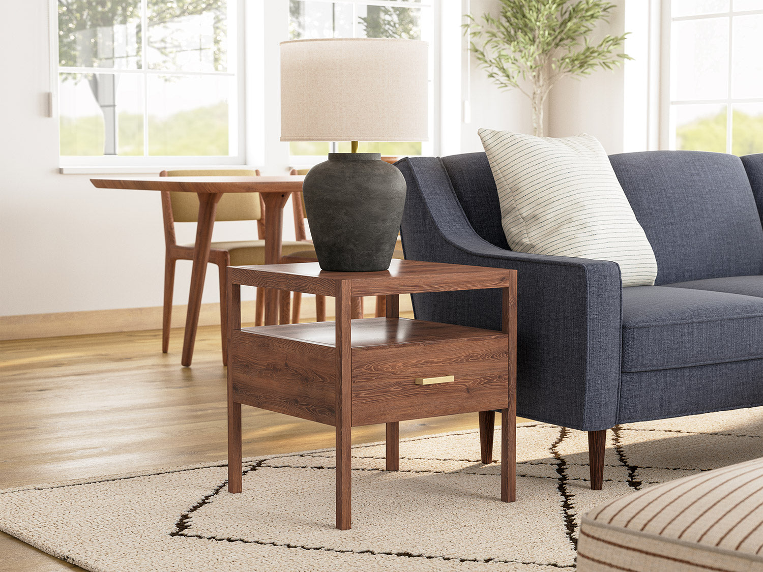 G: Shown in walnut wood with a brass pull next to the Zavis Sectional in Smart Navy fabric