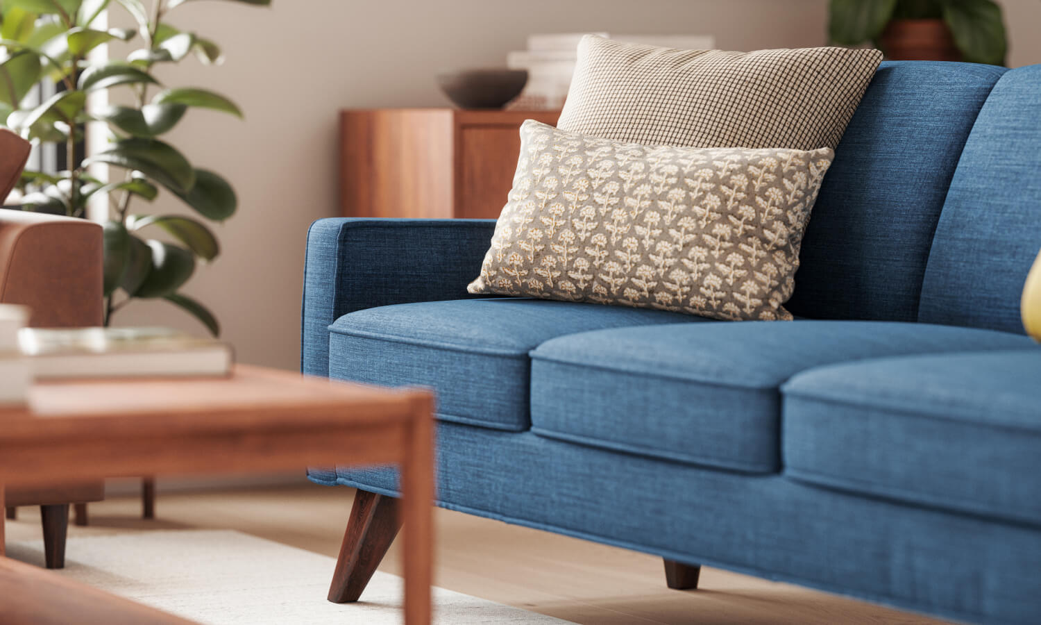 IRL: Zavis Sofa in Deluxe Petrol fabric with Iris Coffee Table and Lulu + Judge Throw Pillows