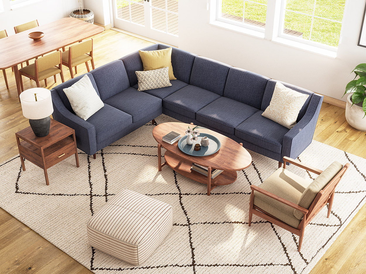 IRL: Zavis Corner Sectional in Smart Denim fabric, Lulu and Judge throw pillows, Iris Coffee Table in walnut wood, Mosh Ottoman, Palder Side Table, and EIM Chair