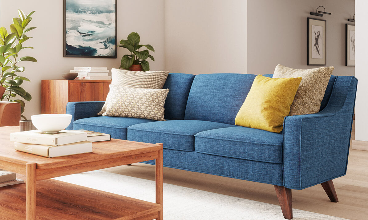 Zavis Sofa in Deluxe Petrol fabric with Lulu Throw Pillow in Kala fabric and Judge Throw Pillow in Phulara fabric
