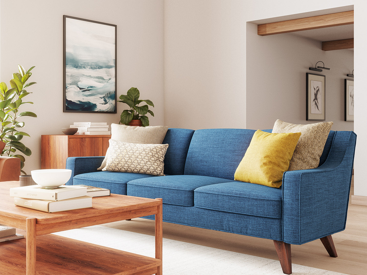 IRL: Zavis Sofa in Deluxe Petrol fabric with Iris Coffee Table and Lulu + Judge Throw Pillows