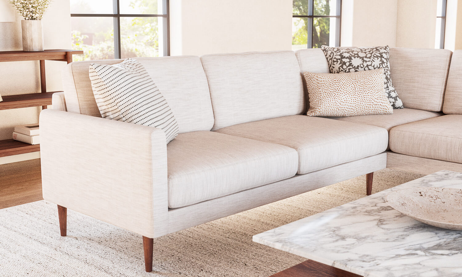 IRL: Lala Bumper 90"x110" Sectional in New Delhi Bleach fabric and Walnut Thom Leg, shown with Sino Coffee Table