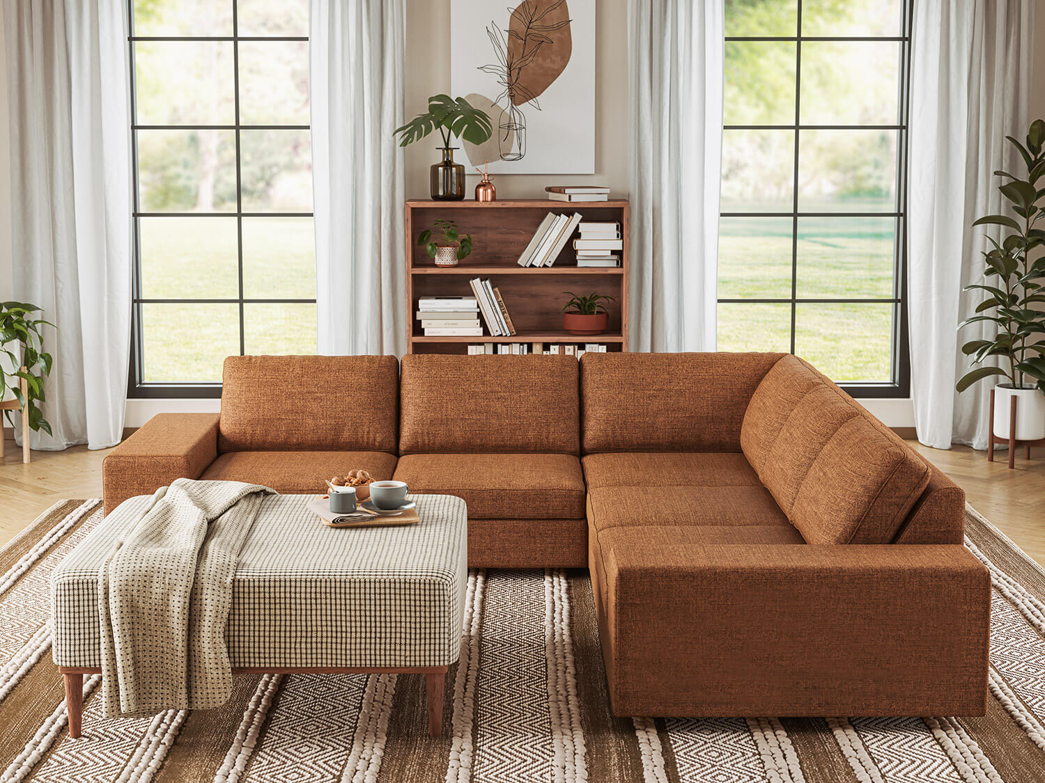 IRL: Blumen Corner Sectional in Deluxe Wood fabric, Noah Ottoman in Kala fabric, Anders Shelf in Walnut