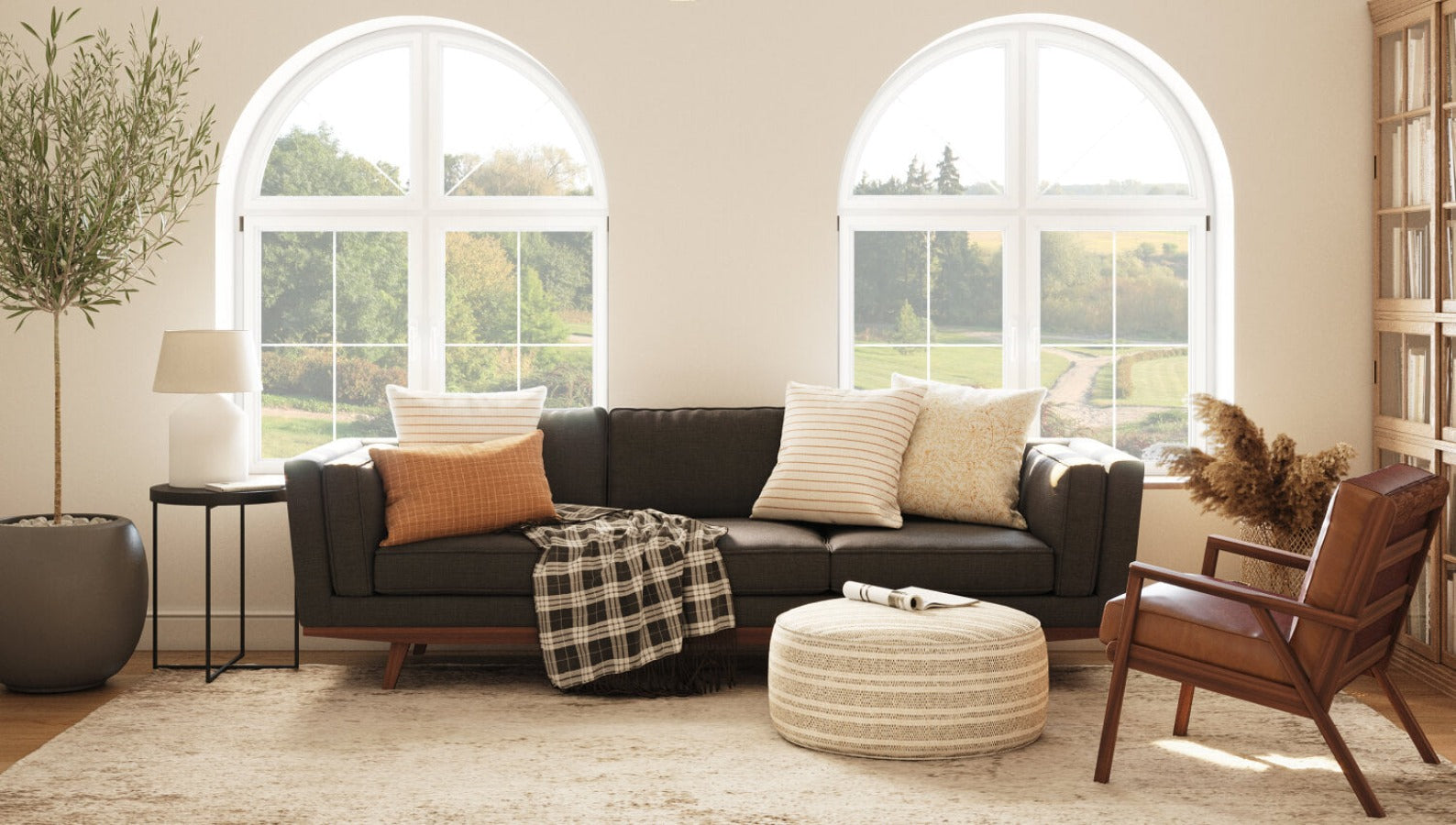 IRL: Shown in Deluxe Elephant Fabric with Lulu PIllows in Sirsi and Bahara, Ridge Chair in Fargo Leather, and Norah Pouf Dhani Fabric