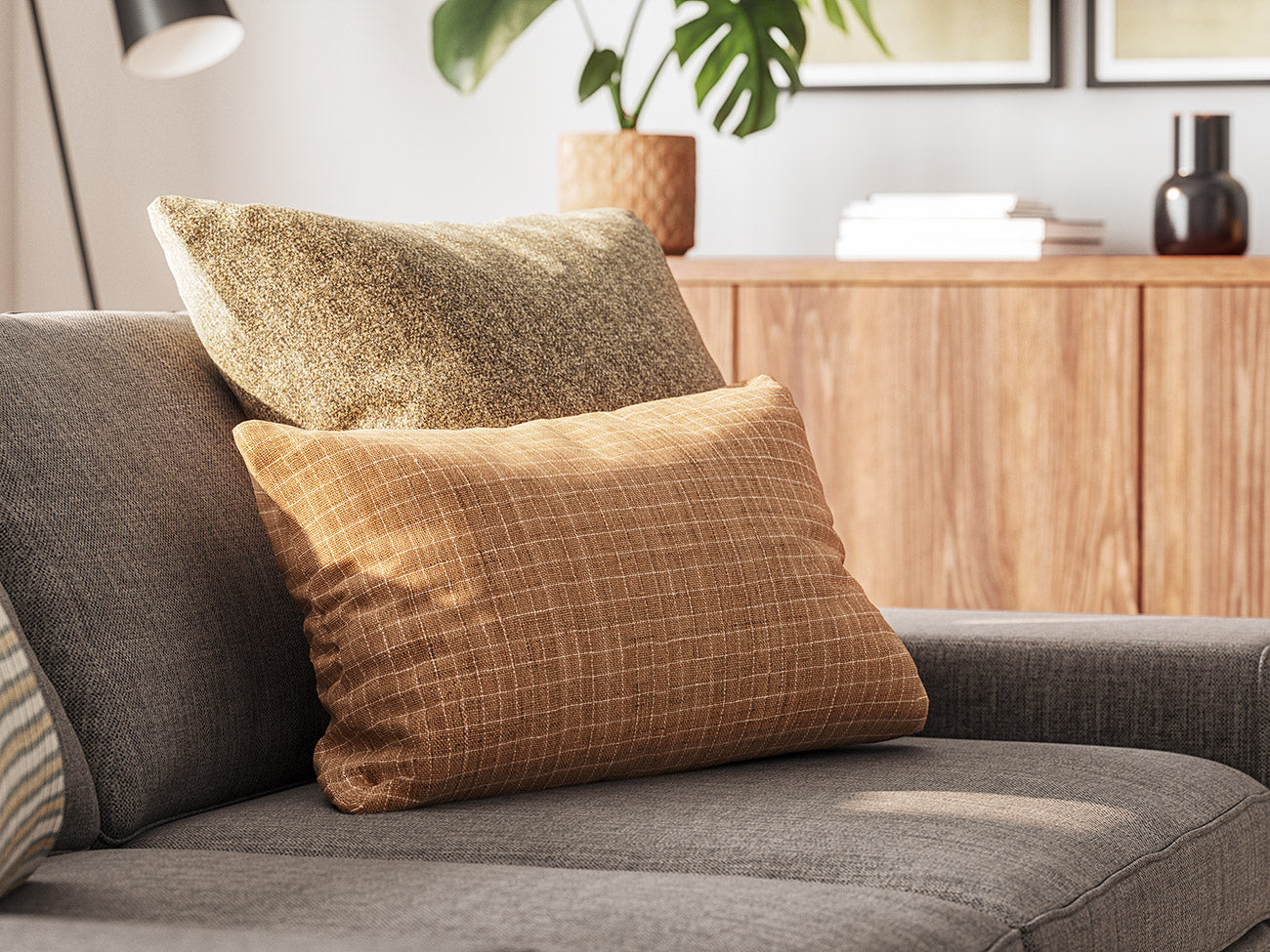 Shown in Jodhani fabric with the Lulu Throw Pillow in Melton Mushroom fabric on top of the Blumen Sofa in Smart Aluminum fabric