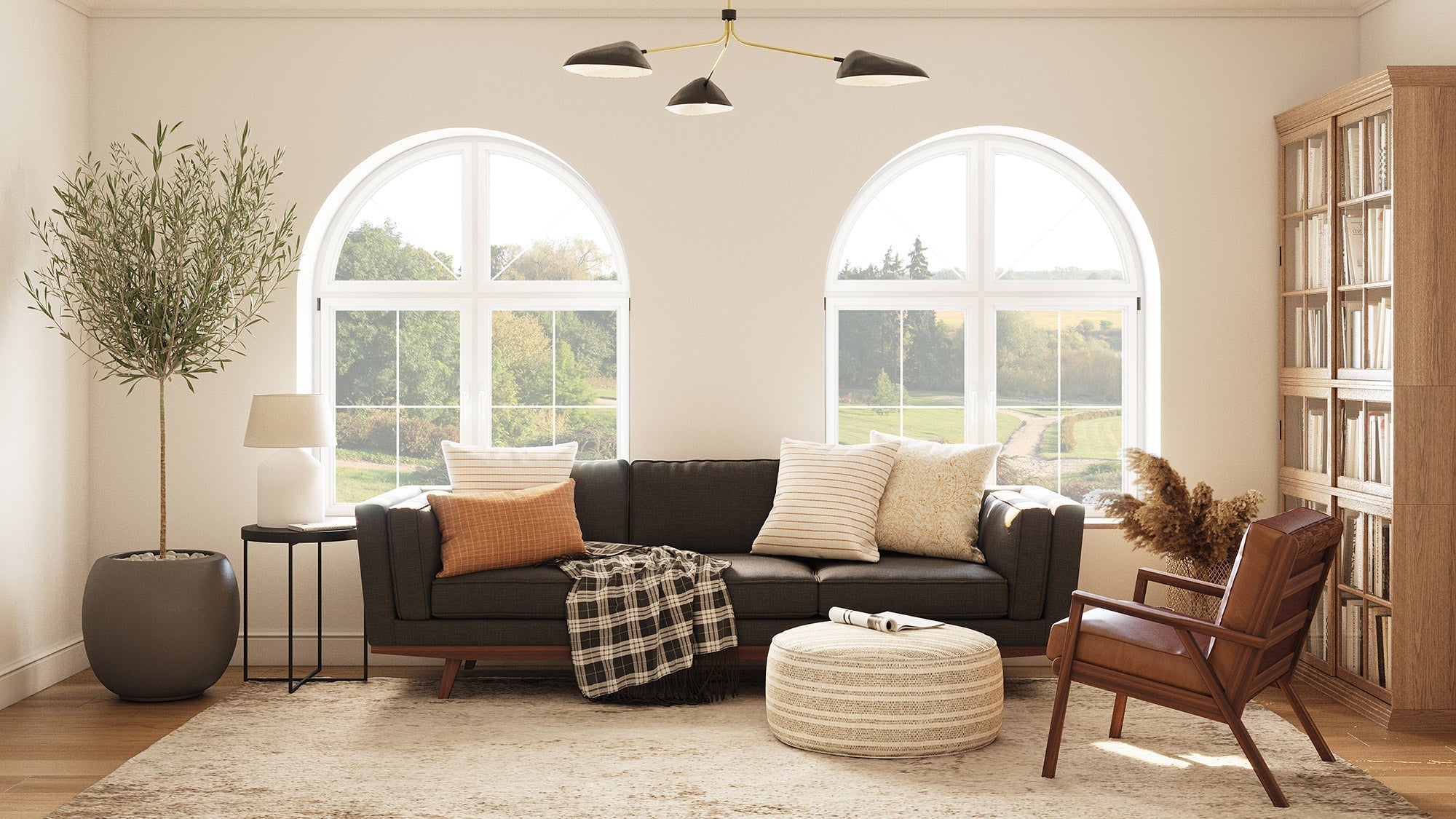 IRL: Shown in Fargo Saddle Leather with Kirnik Sofa in Texture Oyster, Lulu PIllows in Sirsi and Bahara fabrics, and Norah Pouf Dhani fabric