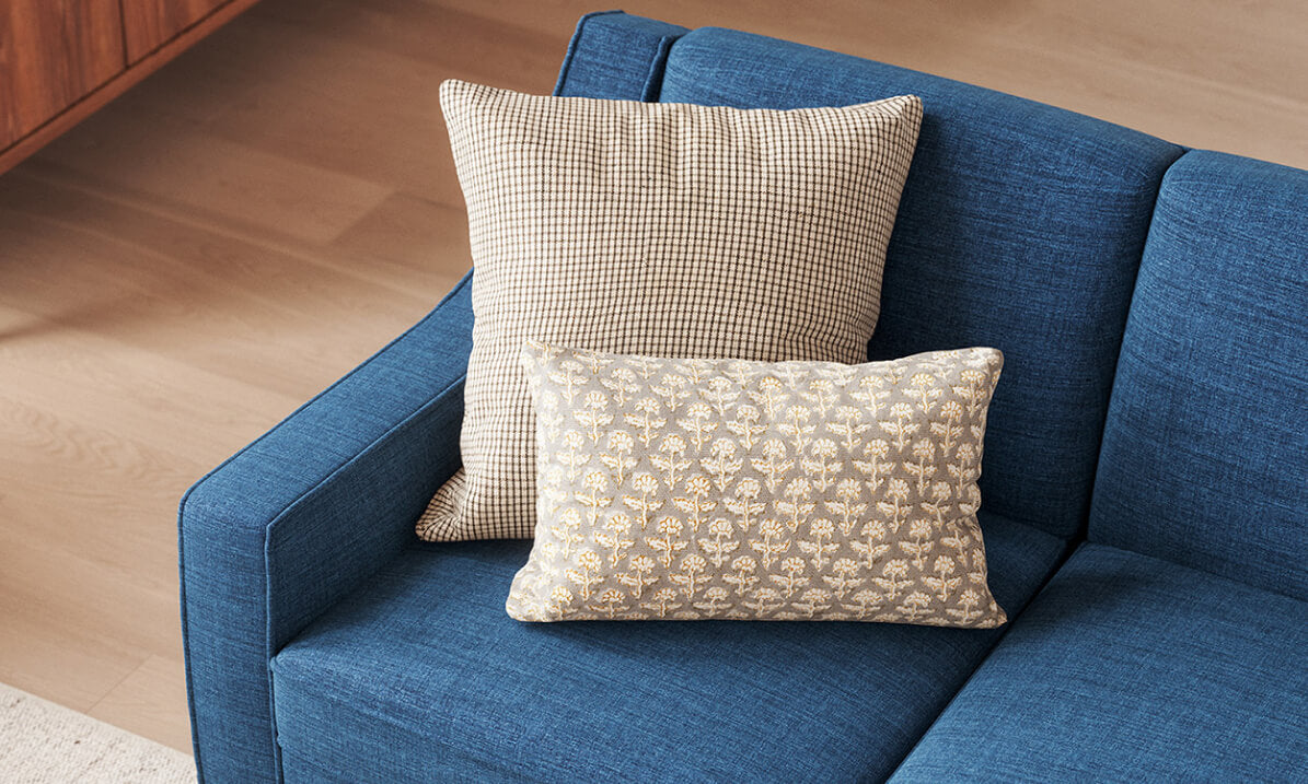 IRL: Zavis Sofa in Deluxe Petrol fabric with Lulu Throw Pillow in Kala fabric and Judge Throw Pillow in Phulara fabric